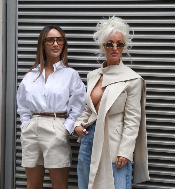 Two women modeling clothing for a brand photoshoot.