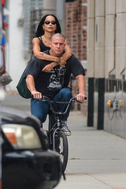 Channing Tatum and Zoe Kravitz riding a BMX bike together.