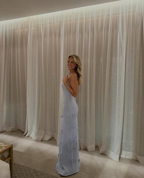 Margarida Corceiro in a light blue dress.