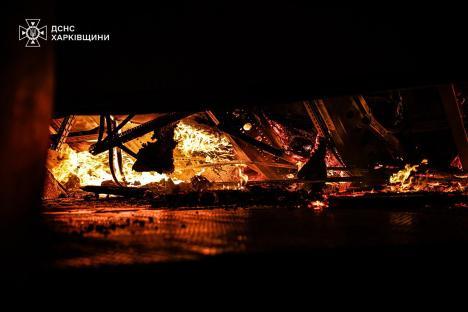Fire burning in a destroyed building.