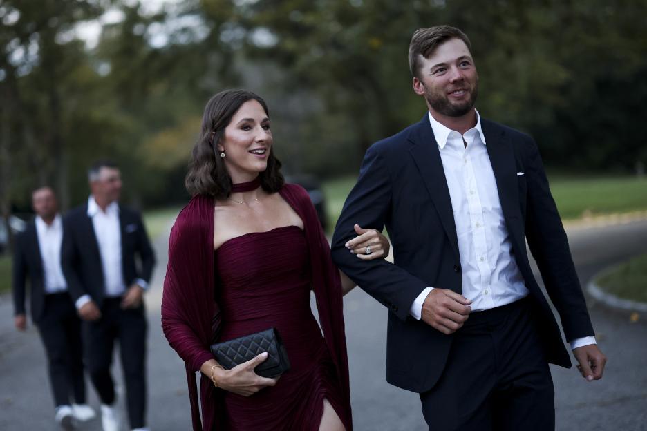 Sam Burns and his wife Caroline Burns arrive for the Ryder Cup Teams' Welcome Dinner.