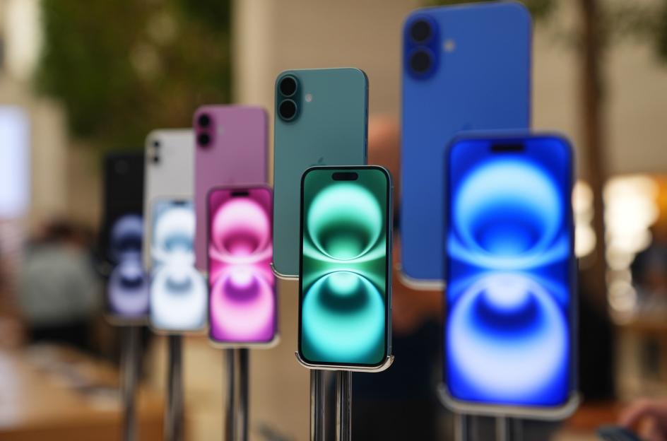 a row of iphones are on display in a store