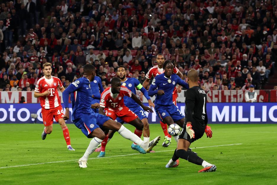 Trevoh Chalobah of Chelsea scores an own goal against Bayern Munich during a Champions League match.