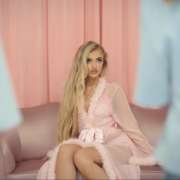 Princess Andre in a pink robe.