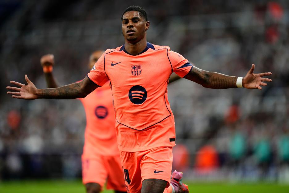 Marcus Rashford, left winger for Barcelona, celebrates after scoring a goal.