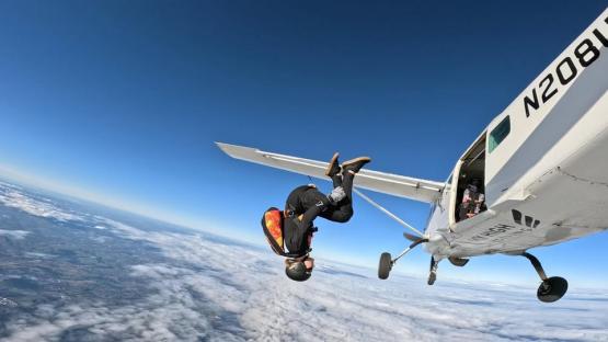 Skydiver exiting a plane.