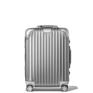 Silver suitcase on wheels.