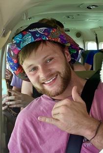 Photo of Sam Gardiner on a small plane.