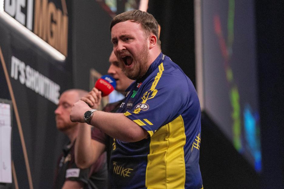 Luke Littler celebrating a Premier League Darts win.