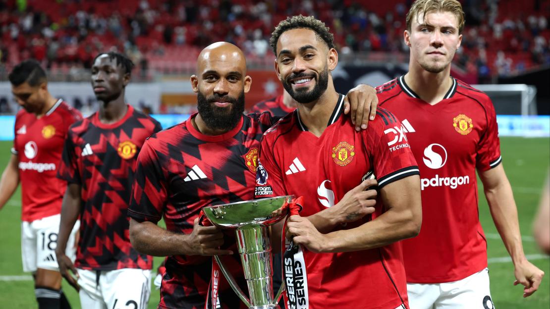 Manchester United players celebrate winning the Summer Series league.
