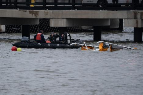NYPD divers recovering a helicopter from the Hudson River.