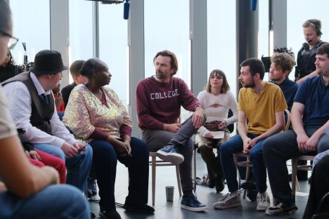 David Tennant and other actors in a scene from The Assembly.