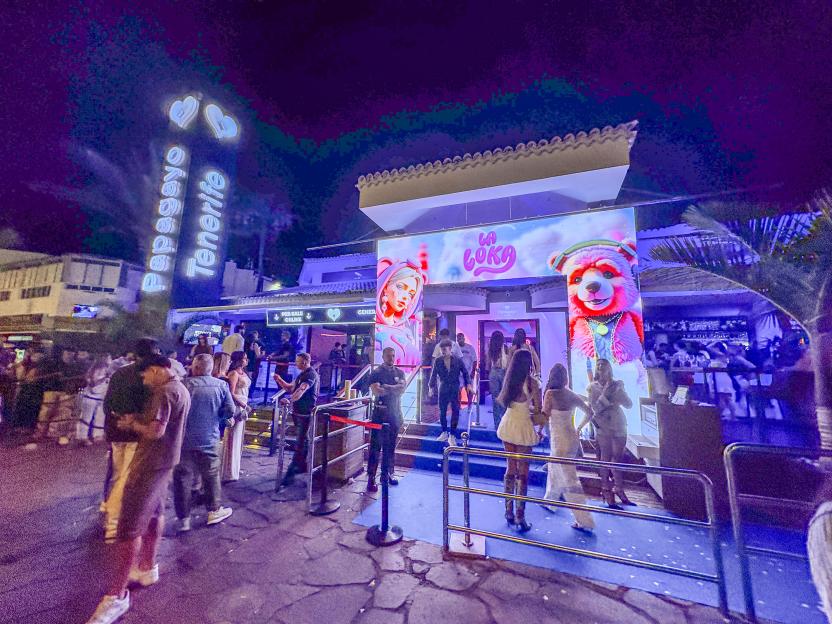 Papagayo Tenerife nightclub at night with people waiting in line.