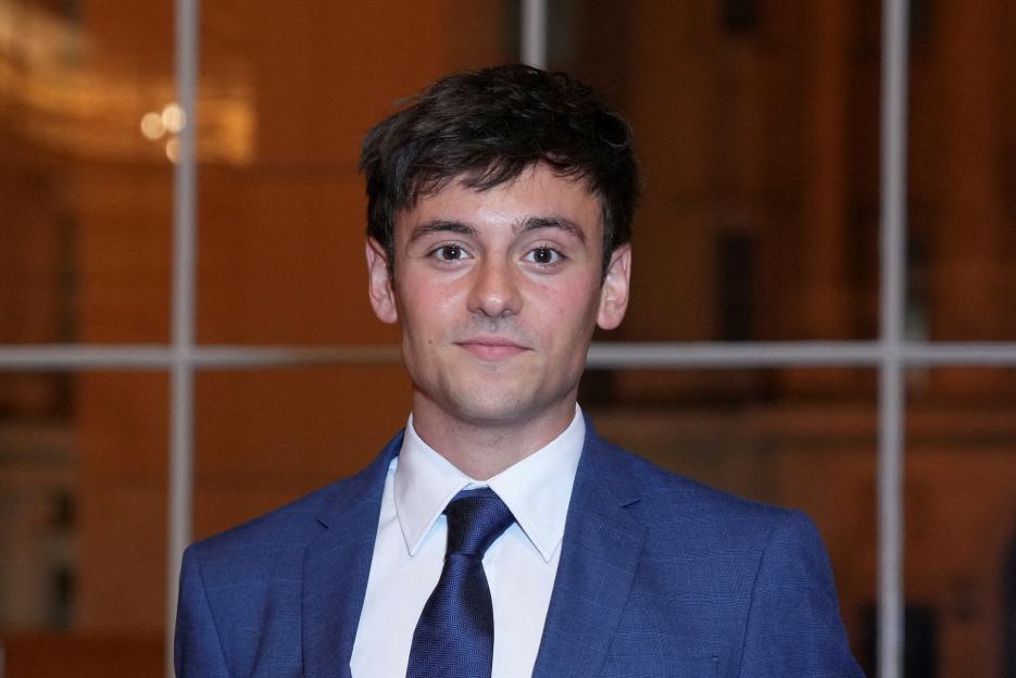 Diver Tom Daley attends a reception at Buckingham Palace.
