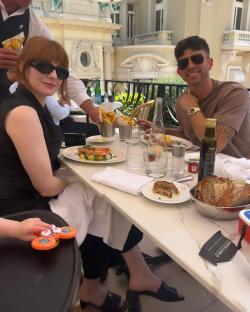 Nicola Roberts and her fiancé enjoying an outdoor meal.