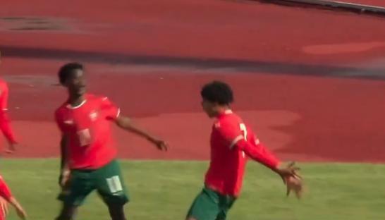 Soccer players celebrating a goal.