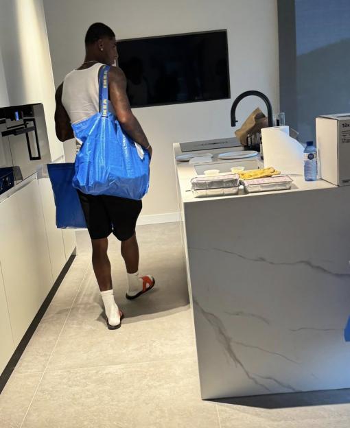 Marcus Rashford carrying IKEA bags in his new Barcelona apartment.