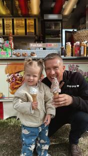 Molly-Mae Hague and her daughter enjoy ice cream at a funfair.