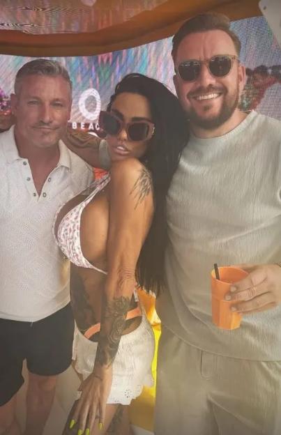 Katie Price with two men in Ibiza.