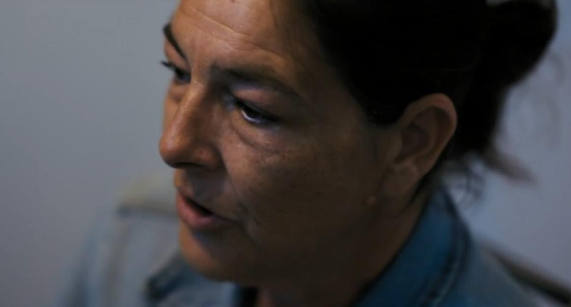 Screenshot of a woman speaking.