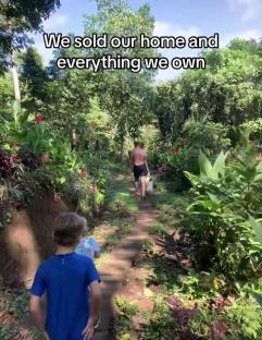 Family walking on a path through lush Balinese jungle.