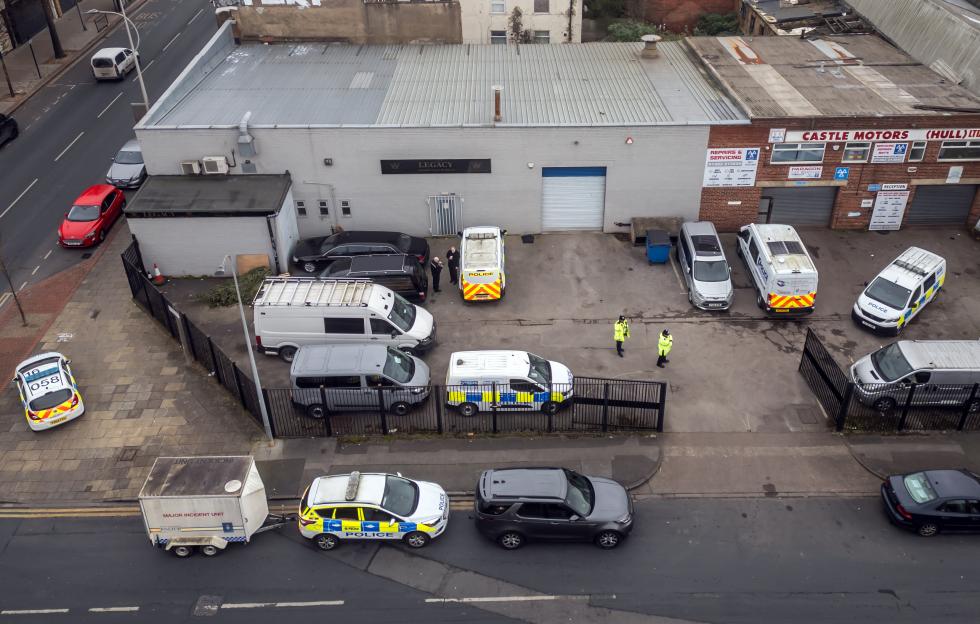 Police cars outside a funeral home.