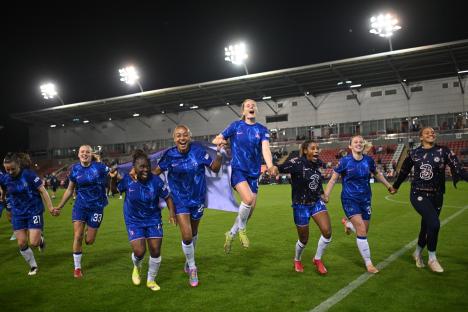 Chelsea FC women's soccer team celebrating a victory.