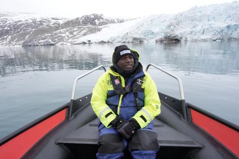 David Lammy on a boat in Svalbard, Norway, viewing a glacier.