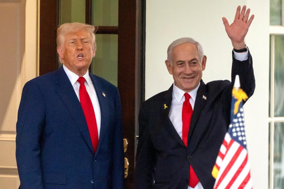 President Donald Trump speaks as Israel's Prime Minister Benjamin Netanyahu waves.