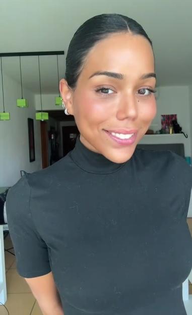 Woman smiling at the camera.