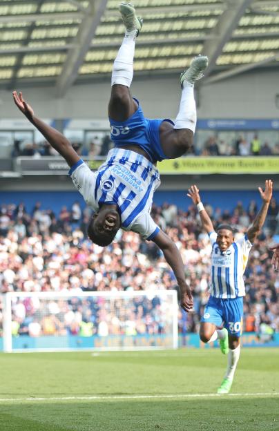 Carlos Baleba of Brighton & Hove Albion celebrates scoring a goal.