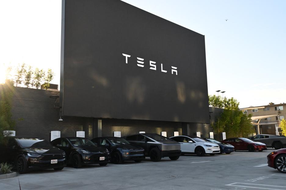 Tesla diner with charging stations and large screen.