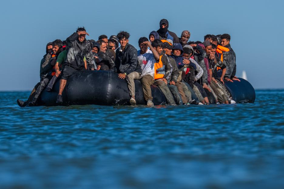 Migrants in a small boat crossing the English Channel.