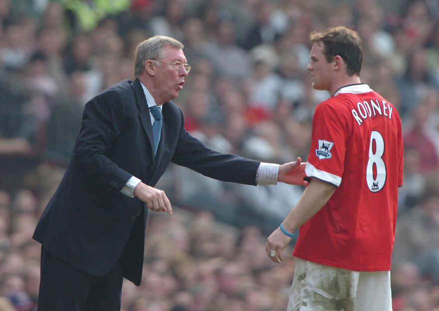 Sir Alex Ferguson instructing Wayne Rooney.