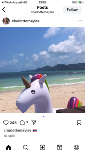 Inflatable unicorn on a beach.