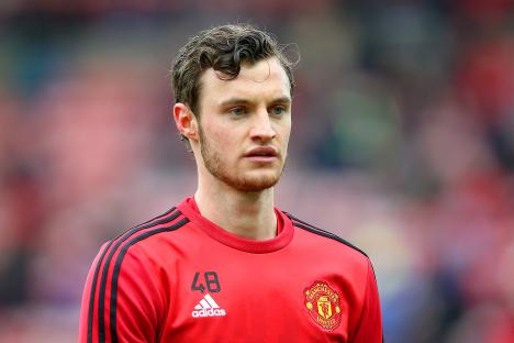 Will Keane of Manchester United warming up before a match.