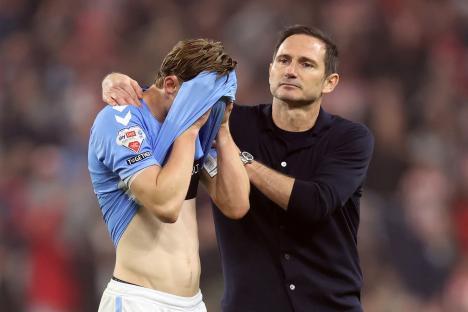 Jack Rudoni of Coventry City being consoled by manager Frank Lampard.