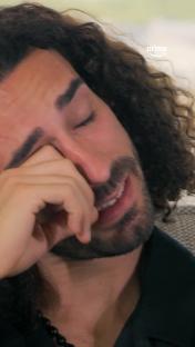 Marc Cucurella wiping away tears.