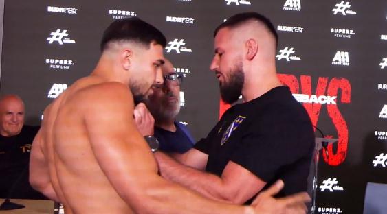 Tommy Fury shoving opponent Kenan Hanjalic at a press conference.