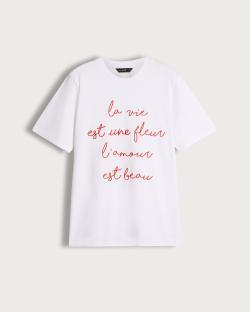 White t-shirt with red French phrase: