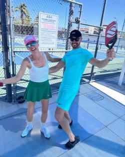 Couple playing pickleball.