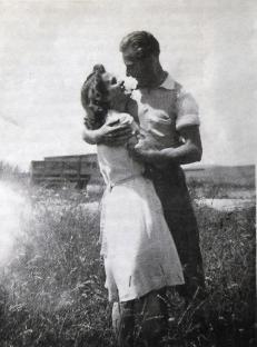 Black and white photo of a couple embracing.