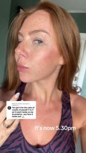 Woman testing makeup foundation.