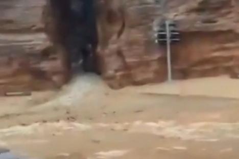Mum and son found dead after flash flooding in tourist hotspot as hundreds are evacuated
