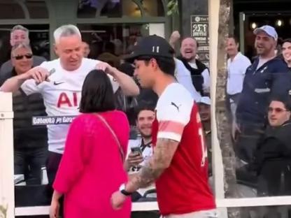 Arsenal fan confronted by Spurs supporters in Bilbao.