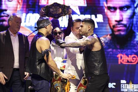 Teofimo Lopez and Arnold Barboza Jr. facing off at a press conference.