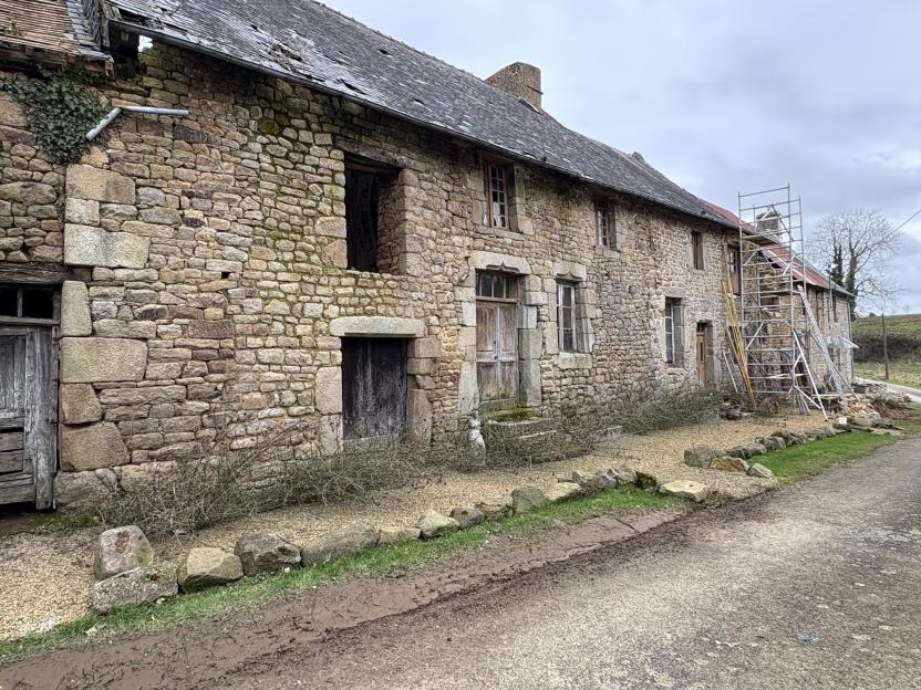 Stone row houses under construction.