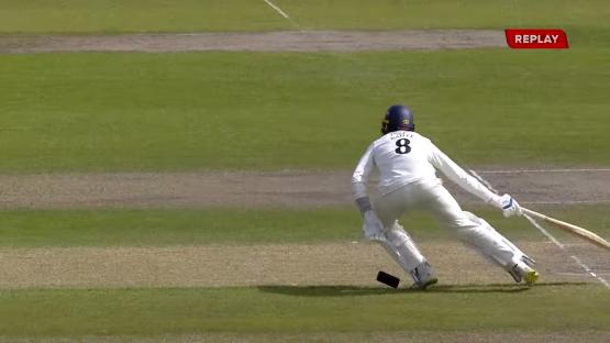 Replay of a cricketer dropping his phone while running.