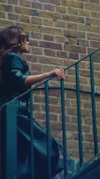 Cheryl climbing a brick staircase.