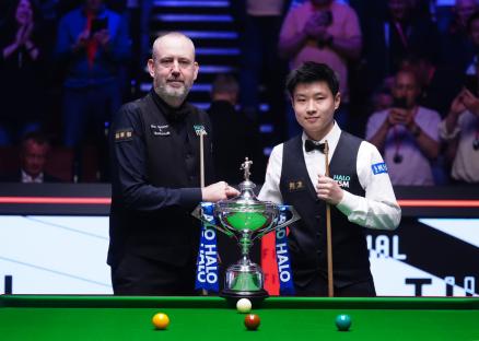Mark Williams and Zhao Xintong pose with the trophy prior to the Final on day sixteen of the Halo World Snooker Championship at the Crucible Theatre, Sheffield. Picture date: Sunday May 4, 2025. PA Photo. See PA story SNOOKER World. Photo credit should read: Mike Egerton/PA Wire. RESTRICTIONS: Use subject to restrictions. Editorial use only, no commercial use without prior consent from rights holder.